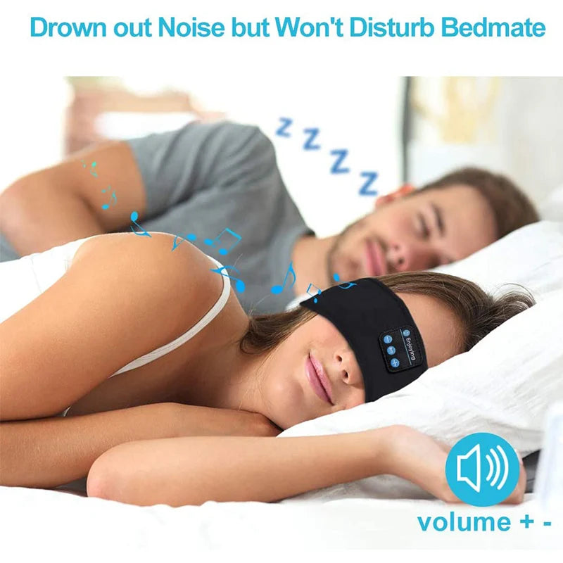 A picture of 2 adults sleeping. One is wearing the Bluetooth headband and listening to music at a level that does not disturb her bedmate