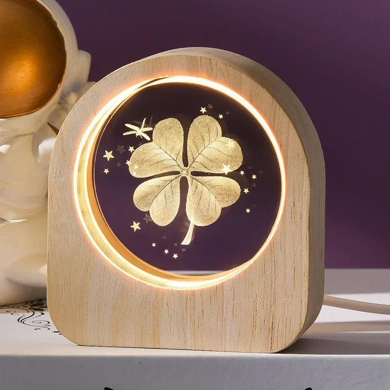 A 3D crystal laser engraved desk decor featuring an image of a four-leaf clover in an illuminated wooden frame.
