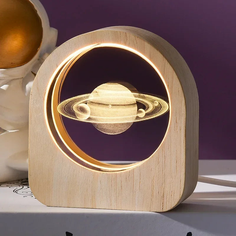 A 3D crystal laser engraved desk decor featuring an image of a planet with several smaller planets in it&