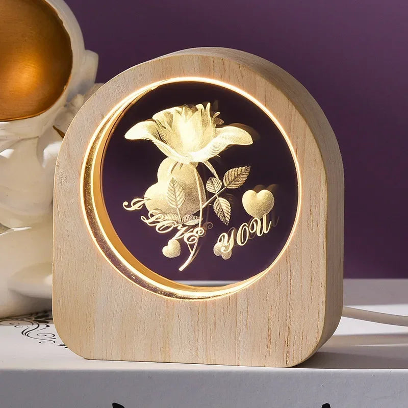A 3D crystal laser engraved desk decor featuring an image a rose with the words I love you in an illuminated wooden frame.