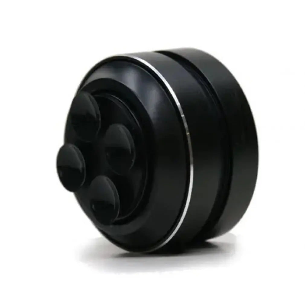 Black circular speaker on a white background